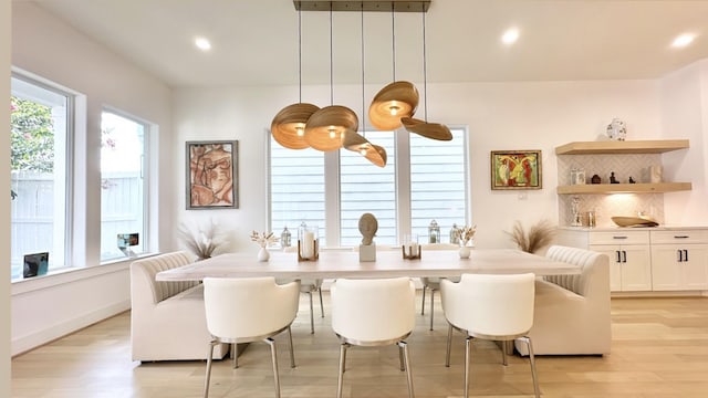 dining area featuring baseboards, recessed lighting, and light wood-style floors