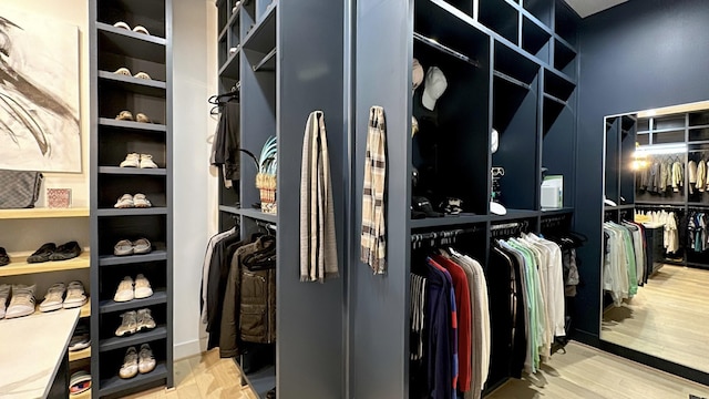 walk in closet featuring wood finished floors