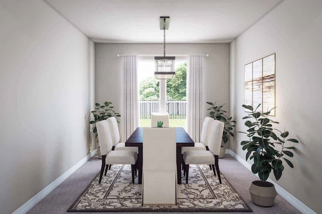 dining space with carpet and baseboards