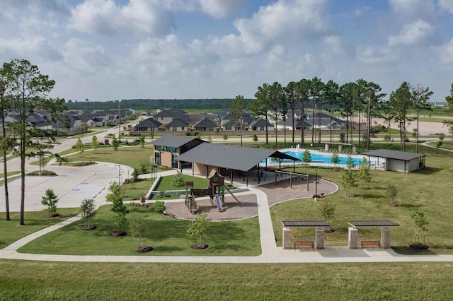 view of community featuring a yard and a residential view