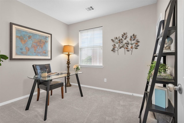 office area with light carpet, visible vents, and baseboards