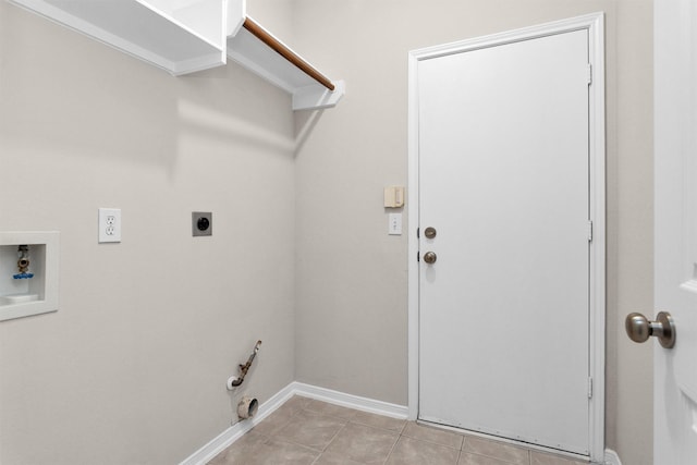 clothes washing area with hookup for a washing machine, hookup for a gas dryer, light tile patterned flooring, electric dryer hookup, and laundry area