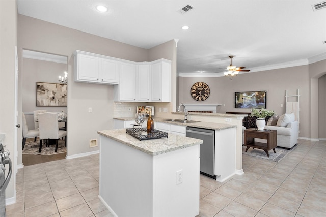 kitchen featuring a peninsula, a sink, visible vents, open floor plan, and stainless steel dishwasher