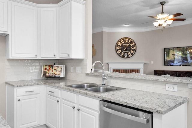 kitchen featuring stainless steel dishwasher, a sink, and white cabinets