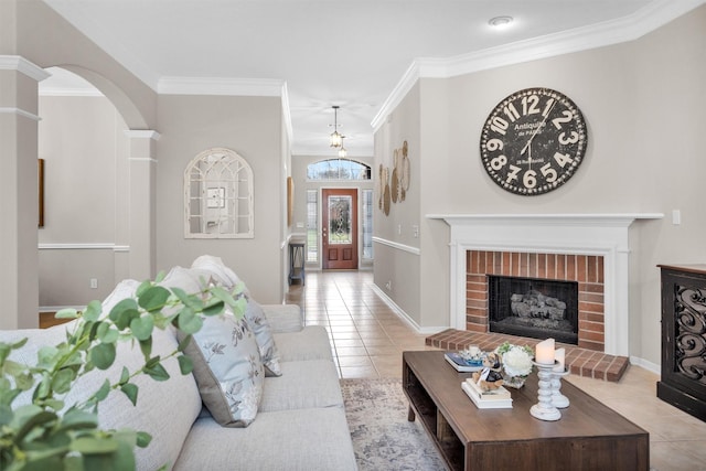 living room with baseboards, light tile patterned flooring, a fireplace, and crown molding