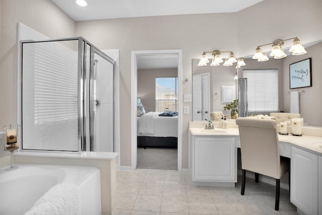 bathroom with a garden tub, a shower stall, vanity, and ensuite bathroom