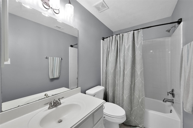 bathroom featuring toilet, shower / bathtub combination with curtain, visible vents, and vanity