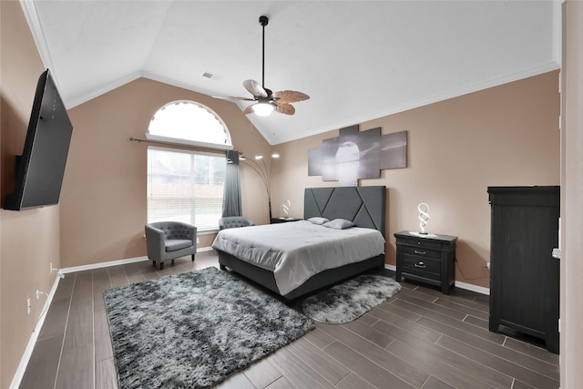 bedroom with ceiling fan, visible vents, baseboards, dark wood-style floors, and lofted ceiling