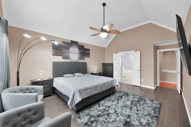 bedroom featuring connected bathroom, wood finish floors, visible vents, baseboards, and vaulted ceiling