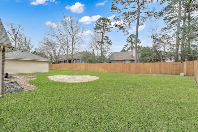 view of yard featuring a patio area and a fenced backyard