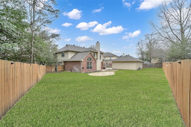 rear view of house featuring roof with shingles, brick siding, a fenced backyard, a chimney, and a lawn