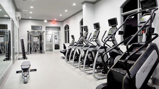 exercise room featuring a wall mounted AC, recessed lighting, and crown molding