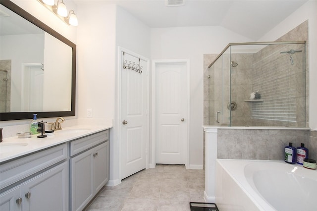 full bath featuring a sink, a bath, tile patterned floors, double vanity, and a stall shower