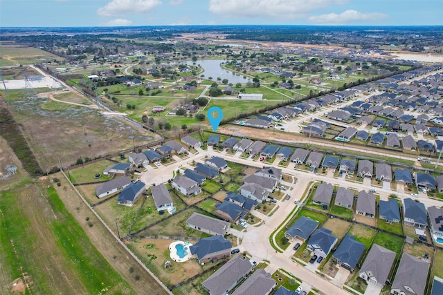 birds eye view of property featuring a water view and a residential view