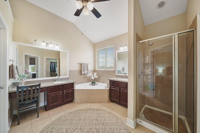 full bathroom featuring lofted ceiling, a garden tub, tile patterned flooring, vanity, and a shower stall