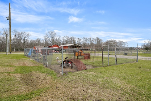 view of yard with exterior structure and an outdoor structure