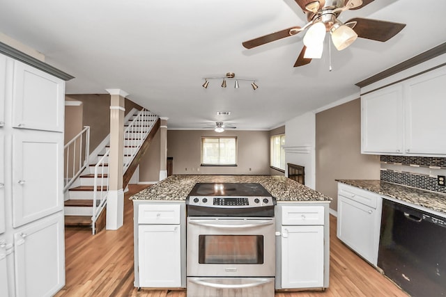 4900 Sandalwood Cir, Baytown, TX 77521 - kitchen with black dishwasher, stainless steel range with electric stovetop, and white cabinetry