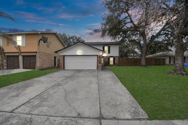 4900 Sandalwood Cir, Baytown, TX 77521 - view of front of property with driveway, a garage, fence, a front yard, and brick siding