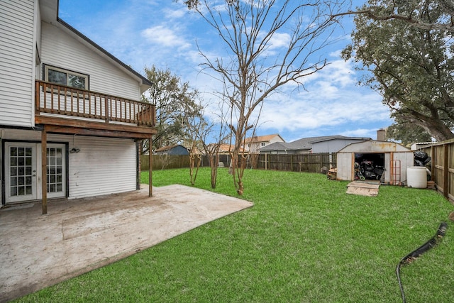 4900 Sandalwood Cir, Baytown, TX 77521 - view of yard featuring a patio area, a fenced backyard, a storage unit, and an outbuilding