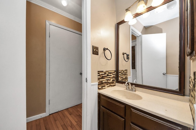 4900 Sandalwood Cir, Baytown, TX 77521 - bathroom with crown molding, vanity, and wood finished floors
