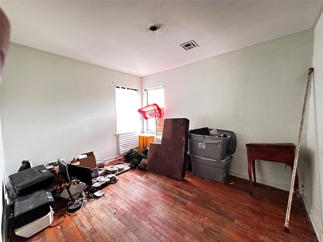 interior space with visible vents and dark wood finished floors