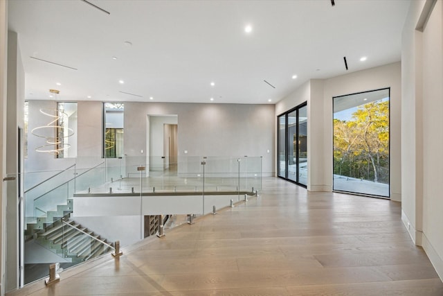 interior space with light wood-style floors, baseboards, and recessed lighting