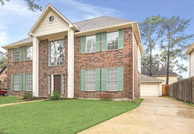 view of front facade featuring a front yard, brick siding, and fence