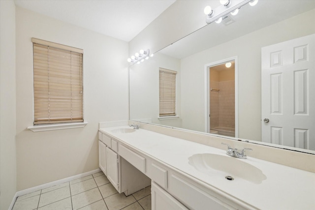 full bath featuring double vanity, a sink, visible vents, and tile patterned floors