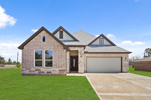 view of front of home featuring a front lawn, roof with shingles, and brick siding