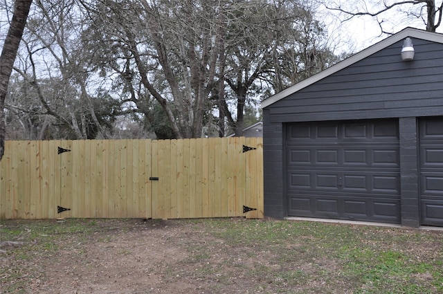 garage featuring fence