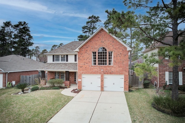 traditional-style house with driveway, a shingled roof, fence, a front lawn, and brick siding