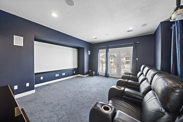 carpeted cinema with visible vents, baseboards, a textured ceiling, and french doors