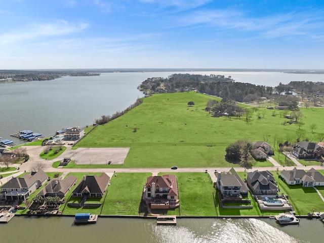 bird's eye view featuring a water view and a residential view