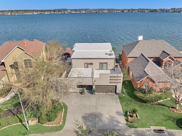 birds eye view of property with a water view