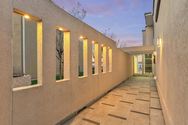 property exterior at dusk with stucco siding