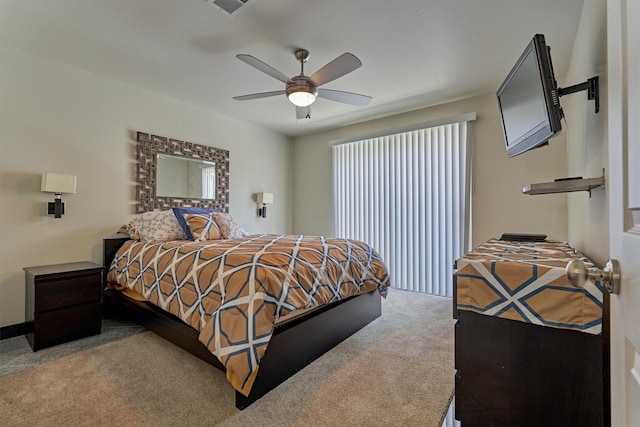 bedroom featuring light carpet, ceiling fan, and visible vents