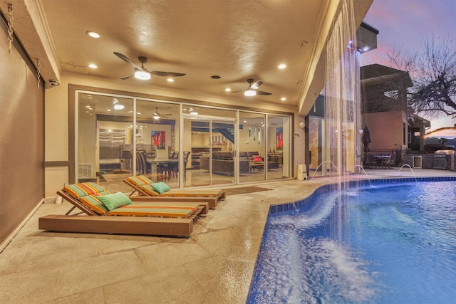 pool at dusk with ceiling fan, a fenced in pool, and a patio