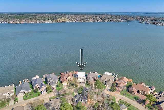 birds eye view of property with a residential view and a water view