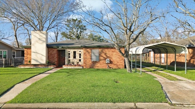 view of front facade featuring brick siding, fence, a carport, a front lawn, and a chimney