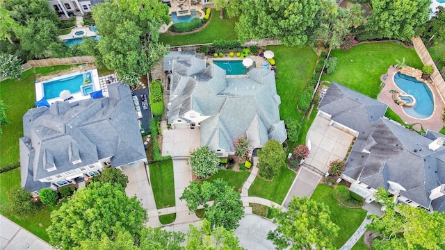 birds eye view of property with a residential view