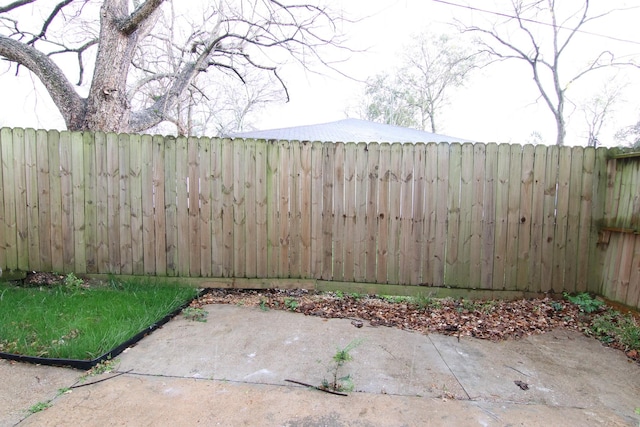 exterior space with a fenced backyard