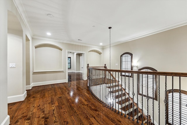 hallway with recessed lighting, an upstairs landing, baseboards, ornamental molding, and dark wood-style floors