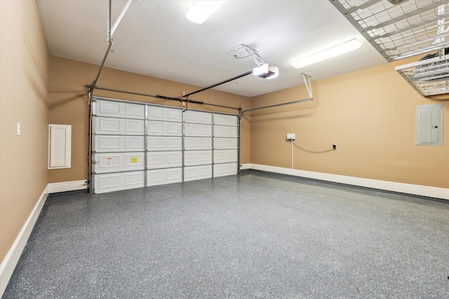 garage featuring a garage door opener, electric panel, and baseboards