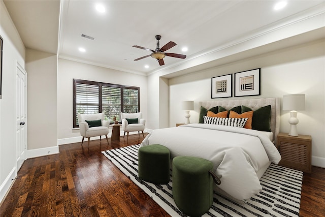 bedroom featuring dark wood finished floors, visible vents, and baseboards