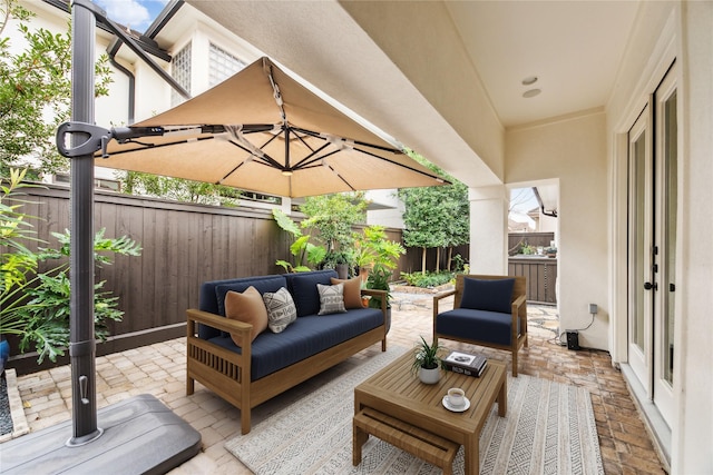 view of patio featuring a fenced backyard and an outdoor living space