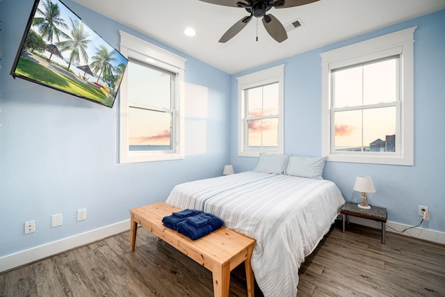 bedroom featuring recessed lighting, visible vents, a ceiling fan, wood finished floors, and baseboards