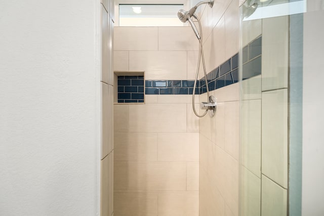 room details with a textured wall and a shower stall