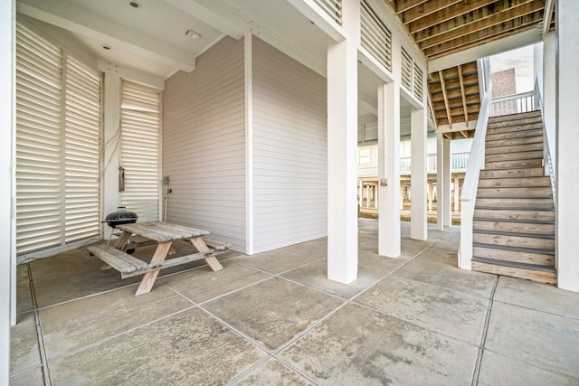 view of patio featuring stairway