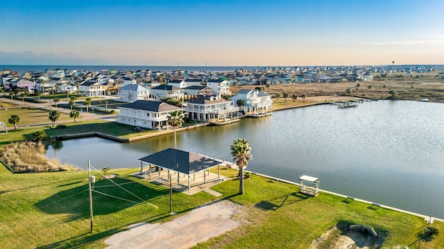 aerial view with a residential view and a water view