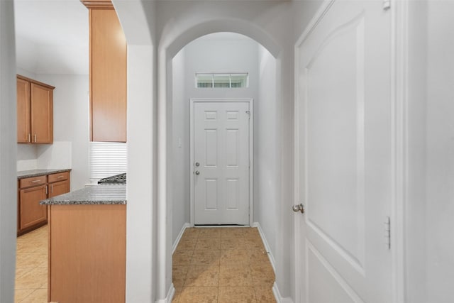 24510 Foxberry Glen Ln, Katy, TX 77494 - entryway featuring baseboards, visible vents, arched walkways, and light tile patterned floors